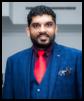 A person in a suit and tie

AI-generated content may be incorrect.